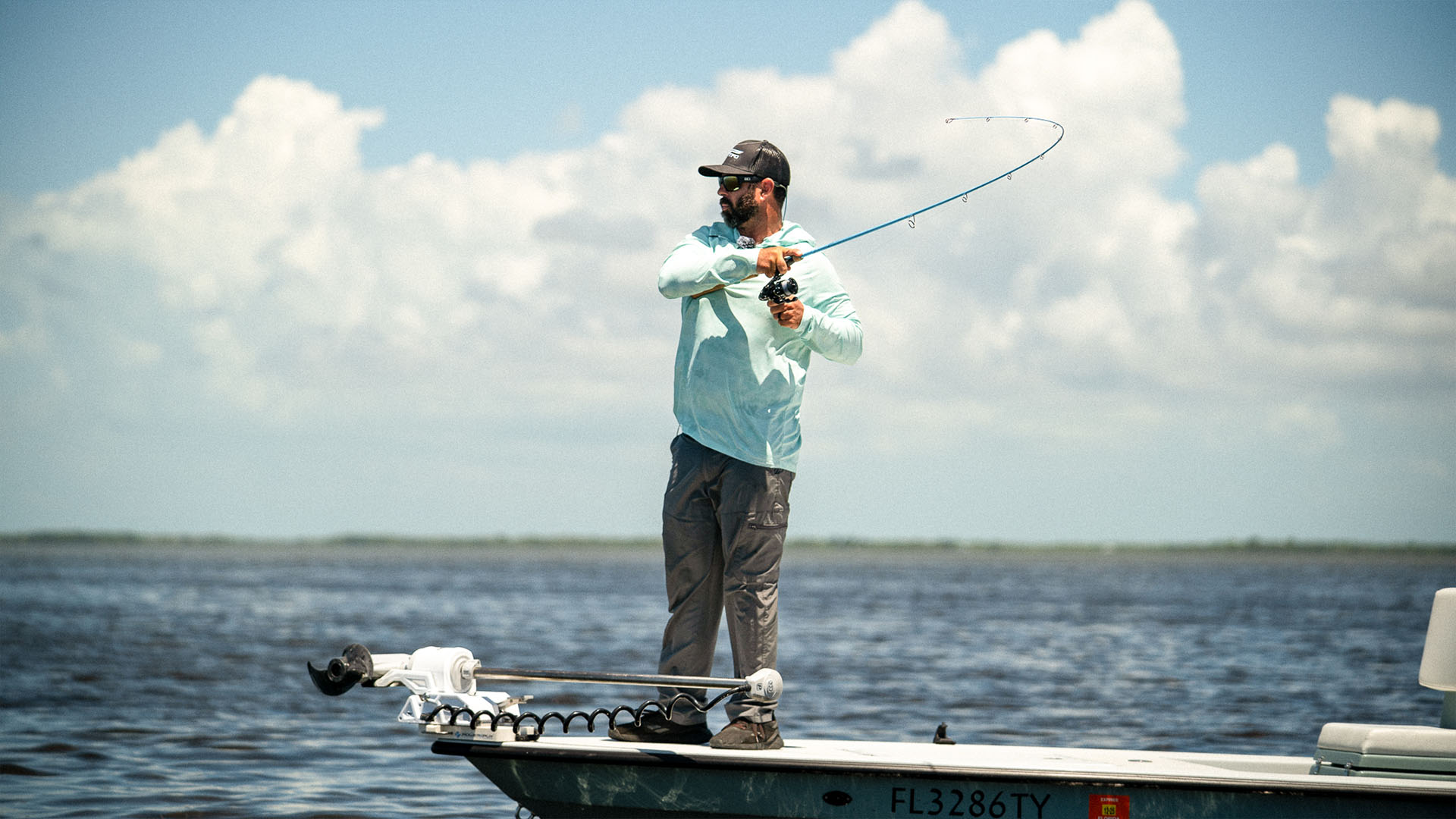 Angler setting the hook on a fish with the TFO IntraCoastal 704 rod, the all-around performer for fall inshore fishing.