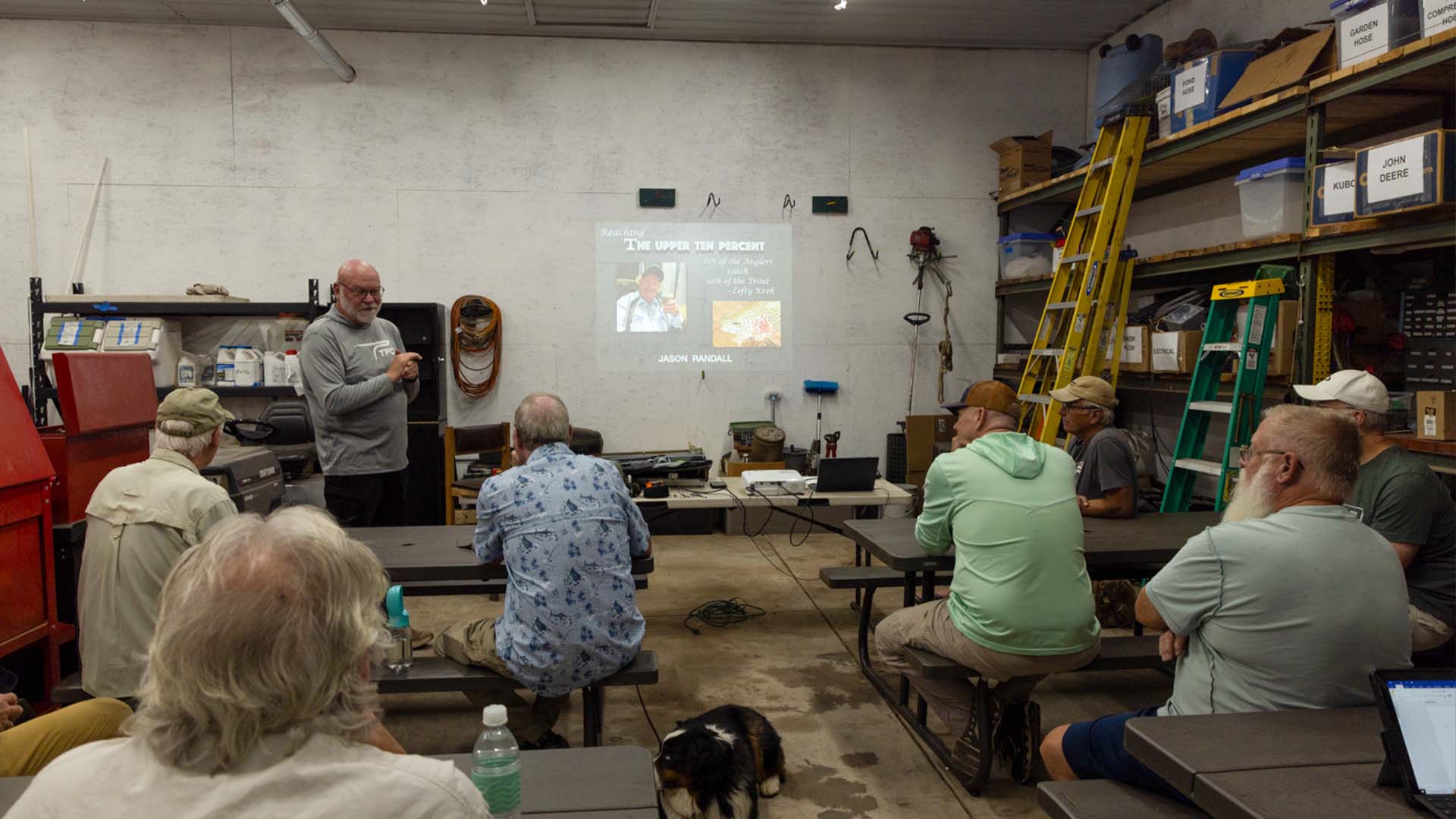 Instructor leading a classroom session during the TFO fly fishing school in Lake George, Colorado, with anglers listening to a presentation on trout fishing techniques