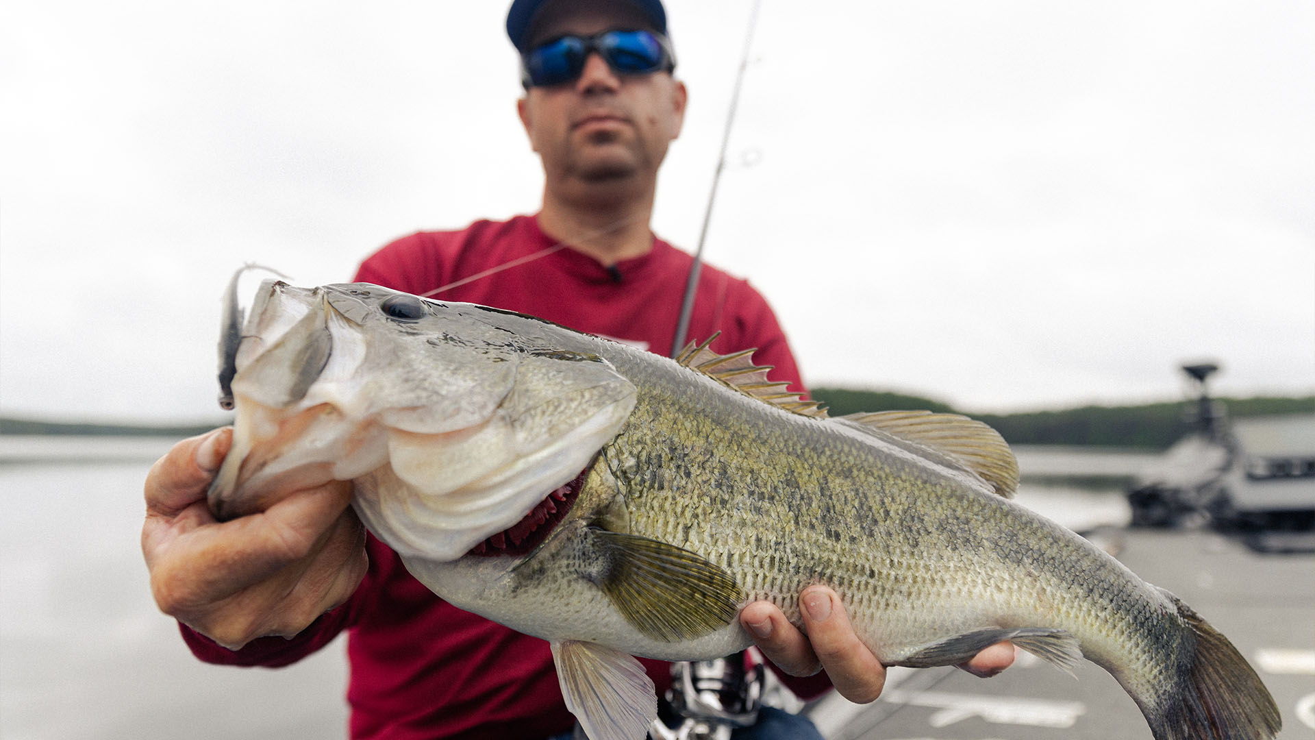 Pro angler Cliff Pace holding a largemouth bass caught on the TFO Resolve 7’3” MH.