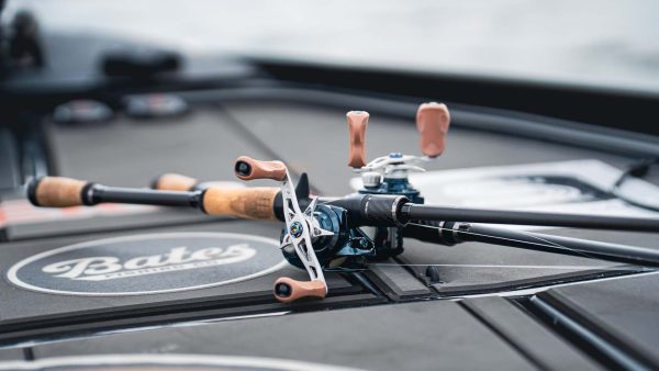 Close-up of TFO Resolve casting rod and reel with carbon fiber reel seat on bass boat deck